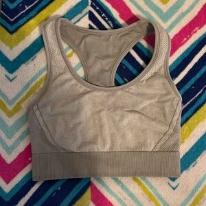 The brand is all in motion, the color gray, and the sizes medium